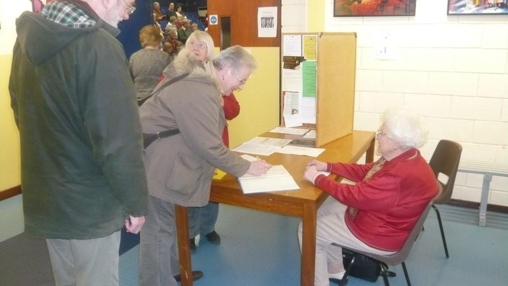 picture of 2 people signing in 